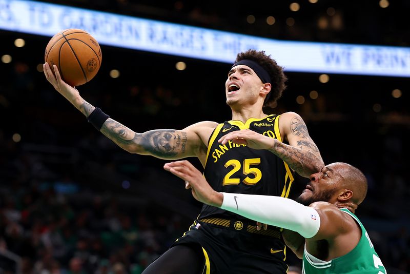 BOSTON, MASSACHUSETTS - MARCH 03: Lester Quinones #25 of the Golden State Warriors takes a shot against Xavier Tillman #26 of the Boston Celtics during the second half at TD Garden on March 03, 2024 in Boston, Massachusetts. The Celtics defeat the Warriors 140-88. NOTE TO USER: User expressly acknowledges and agrees that, by downloading and or using this photograph, user is consenting to the terms and conditions of the Getty Images License Agreement.  (Photo by Maddie Meyer/Getty Images)