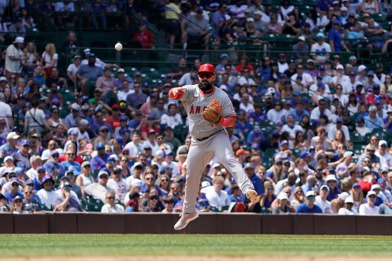 Jul 6, 2024; Chicago, Illinois, USA; Los Angeles Angels third baseman Luis Guillorme (15) makes a play on Chicago Cubs second baseman Nico Hoerner (not pictured) during the sixth inning at Wrigley Field. Mandatory Credit: David Banks-USA TODAY Sports