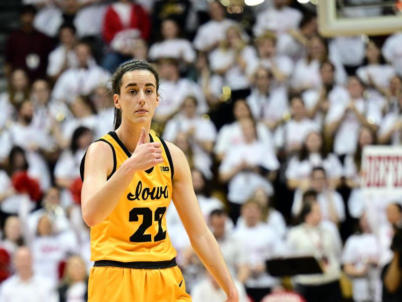 Feb 22, 2024; Bloomington, Indiana, USA; Iowa Hawkeyes guard Caitlin Clark (22) gives a thumbs up during the first quarter against the Indiana Hoosiers at Simon Skjodt Assembly Hall. Mandatory Credit: Marc Lebryk-USA TODAY Sports