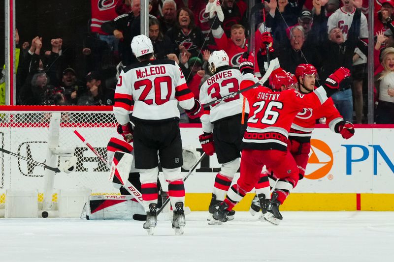 May 11, 2023; Raleigh, North Carolina, USA; Carolina Hurricanes right wing Jesper Fast (71) celebrates his goal in overtime against the New Jersey Devils in game five of the second round of the 2023 Stanley Cup Playoffs at PNC Arena. Mandatory Credit: James Guillory-USA TODAY Sports