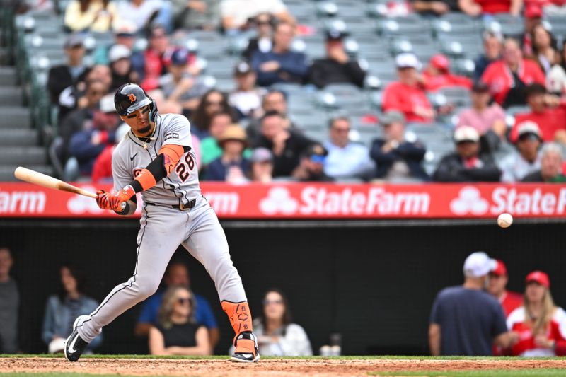 May 4, 2025; Anaheim, California, USA; Detroit Tigers outfielder Javier Báez (28) doubles against the Los Angeles Angels during the ninth inning at Angel Stadium. Mandatory Credit: Jonathan Hui-Imagn Images