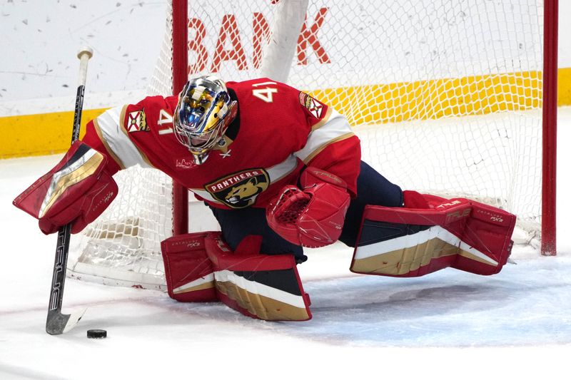 Dec 30, 2023; Sunrise, Florida, USA;  Florida Panthers goaltender Anthony Stolarz (41) gathers the puck during the second period against the Montreal Canadiens at Amerant Bank Arena. Mandatory Credit: Jim Rassol-USA TODAY Sports