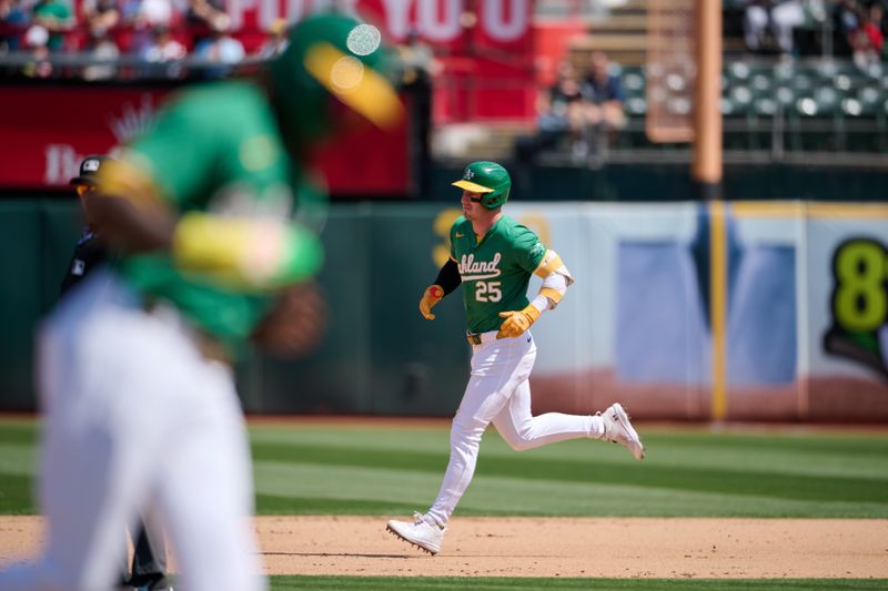 Aug 24, 2024; Oakland, California, USA; Oakland Athletics outfielder Brent Rooker (25) (center) runs the bases with outfielder Lawrence Butler (4) after hitting a two run home run against the Milwaukee Brewers during the sixth inning at Oakland-Alameda County Coliseum. Mandatory Credit: Robert Edwards-USA TODAY Sports