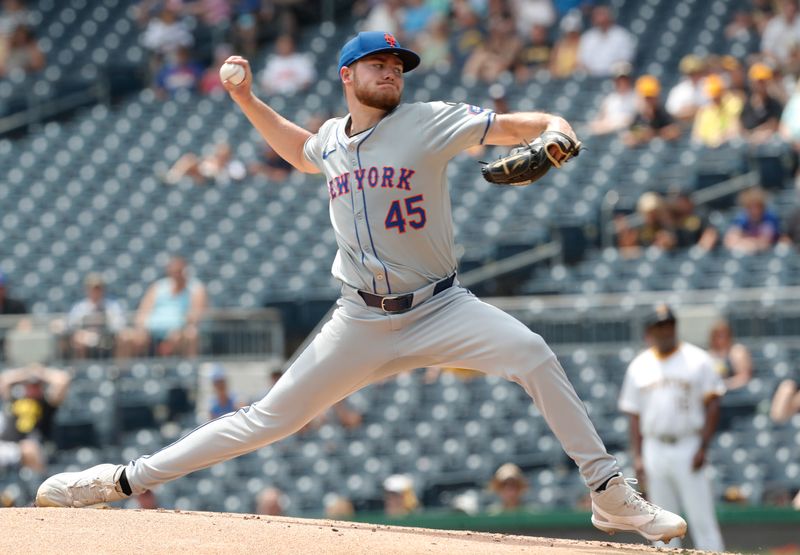 Jul 8, 2024; Pittsburgh, Pennsylvania, USA;  New York Mets starting pitcher Christian Scott (45) delivers a pitch against the Pittsburgh Pirates during the first inning  at PNC Park. Mandatory Credit: Charles LeClaire-USA TODAY Sports