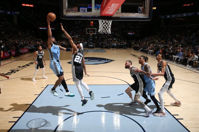 MEMPHIS, TN - APRIL 9: Jordan Goodwin #4 of the Memphis Grizzlies drives to the basket during the game against the San Antonio Spurs on April 9, 2024 at FedExForum in Memphis, Tennessee. NOTE TO USER: User expressly acknowledges and agrees that, by downloading and or using this photograph, User is consenting to the terms and conditions of the Getty Images License Agreement. Mandatory Copyright Notice: Copyright 2024 NBAE (Photo by Joe Murphy/NBAE via Getty Images)