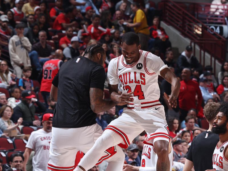 CHICAGO, IL - APRIL 9: Andre Drummond #3 and Javonte Green #24 of the Chicago Bulls embrace before the game against the New York Knicks on April 9, 2024 at United Center in Chicago, Illinois. NOTE TO USER: User expressly acknowledges and agrees that, by downloading and or using this photograph, User is consenting to the terms and conditions of the Getty Images License Agreement. Mandatory Copyright Notice: Copyright 2024 NBAE (Photo by Jeff Haynes/NBAE via Getty Images)