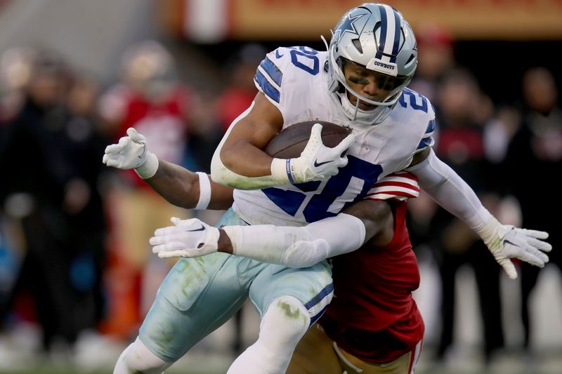 Dallas Cowboys running back Tony Pollard (20) is tackled by San Francisco 49ers cornerback Jimmie Ward (1) during an NFL divisional round playoff football game, Sunday, Jan. 22, 2023, in Santa Clara, Calif. (AP Photo/Scot Tucker)