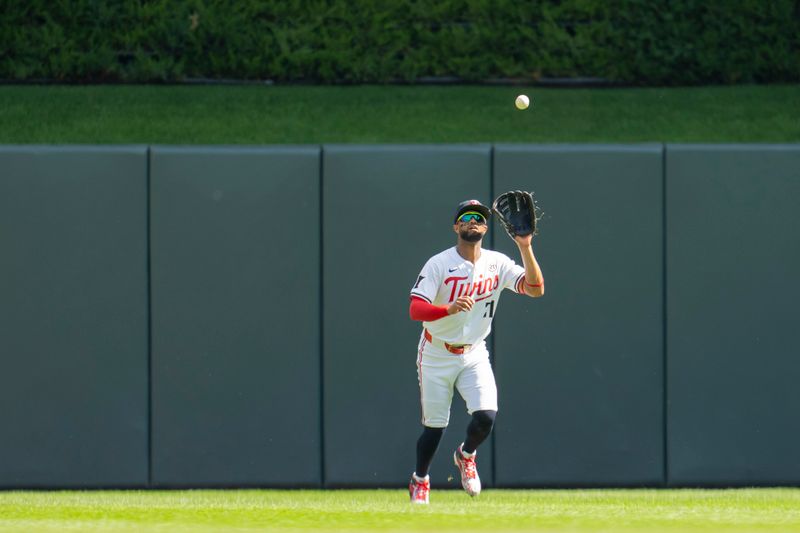 Sep 15, 2024; Minneapolis, Minnesota, USA; Minnesota Twins center fielder Willi Castro (50) catches a fly ball against the Cincinnati Reds in the fourth inning at Target Field. Mandatory Credit: Jesse Johnson-Imagn Images