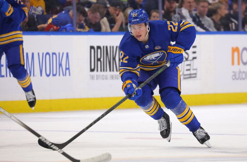 Apr 11, 2024; Buffalo, New York, USA;  Buffalo Sabres right wing Jack Quinn (22) skates up ice with the puck during the second period against the Washington Capitals at KeyBank Center. Mandatory Credit: Timothy T. Ludwig-USA TODAY Sports
