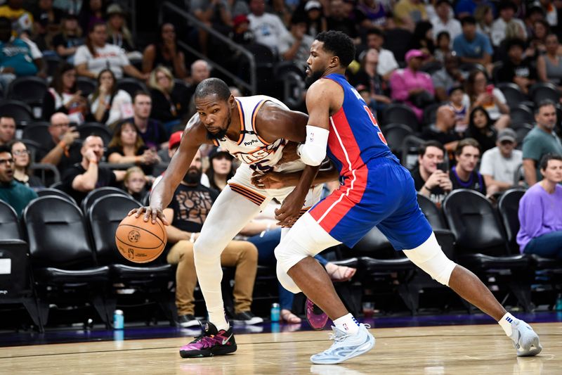 PHOENIX, ARIZONA - OCTOBER 11: Kevin Durant #35 of the Phoenix Suns drives to the basket against Malik Beasley #5 of the Detroit Pistons during the second half of the preseason game at Footprint Center on October 11, 2024 in Phoenix, Arizona.  NOTE TO USER: User expressly acknowledges and agrees that, by downloading and/or using this photograph, user is consenting to the terms and conditions of the Getty Images License Agreement. (Photo by Kelsey Grant/Getty Images)