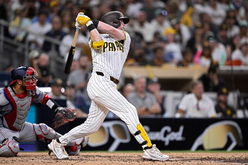 Jun 25, 2024; San Diego, California, USA; San Diego Padres second baseman Jake Cronenworth (9) hits an RBI double during the fifth inning against the Washington Nationals at Petco Park. Mandatory Credit: Orlando Ramirez-USA TODAY Sports