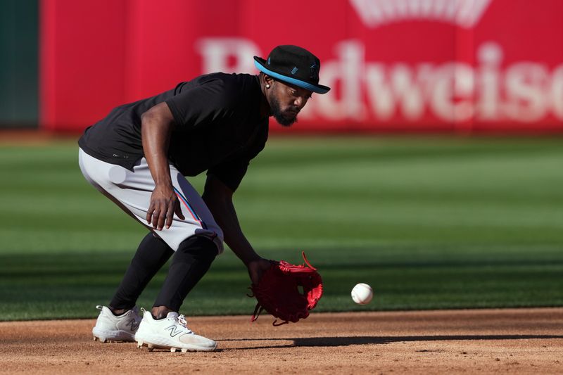 May 3, 2024; Oakland, California, USA; Miami Marlins third baseman Vidal Brujan (17) warms up before the game against the Oakland Athletics at Oakland-Alameda County Coliseum. Mandatory Credit: Darren Yamashita-USA TODAY Sports