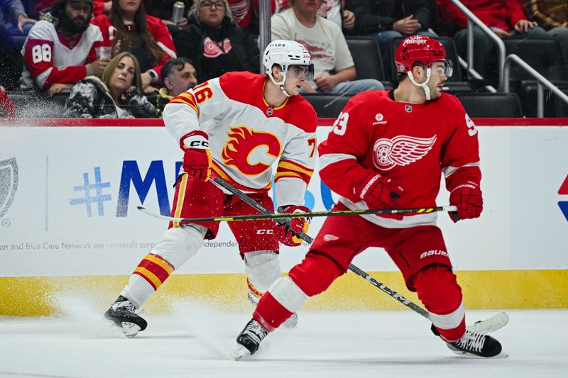 Nov 27, 2024; Detroit, Michigan, USA; Calgary Flames center Martin Pospisil (76) brings the puck up ice against Detroit Red Wings right wing Alex DeBrincat (93) during the first period at Little Caesars Arena. Mandatory Credit: Tim Fuller-Imagn Images