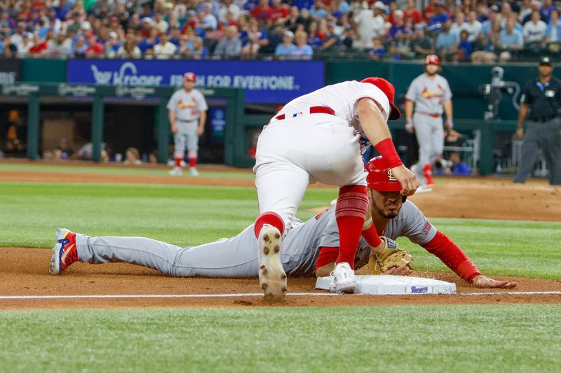 Jun 7, 2023; Arlington, Texas, USA; St. Louis Cardinals third baseman Nolan Arenado (28) is tagged out by Texas Rangers third baseman Josh Jung (6) during the fifth inning at Globe Life Field. Mandatory Credit: Andrew Dieb-USA TODAY Sports