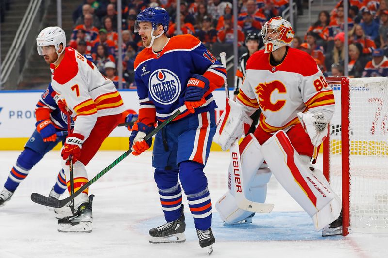 Oct 13, 2024; Edmonton, Alberta, CAN; Edmonton Oilers forward Zach Hyman (18) tries to screen Calgary Flames goaltender Dan Vladar (80) during the first period at Rogers Place. Mandatory Credit: Perry Nelson-Imagn Images