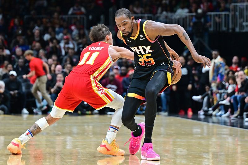 ATLANTA, GA - FEBRUARY 2: Trae Young #11 of the Atlanta Hawks steals ball during the game against the Phoenix Suns on February 2, 2024 at State Farm Arena in Atlanta, Georgia.  NOTE TO USER: User expressly acknowledges and agrees that, by downloading and/or using this Photograph, user is consenting to the terms and conditions of the Getty Images License Agreement. Mandatory Copyright Notice: Copyright 2024 NBAE (Photo by Adam Hagy/NBAE via Getty Images)