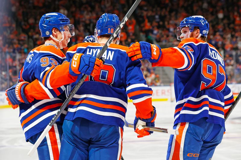 Oct 25, 2024; Edmonton, Alberta, CAN; The Edmonton Oilers celebrate a goal scored by forward Ryan Nugent-Hopkins (93) during the third period against the Pittsburgh Penguins at Rogers Place. Mandatory Credit: Perry Nelson-Imagn Images