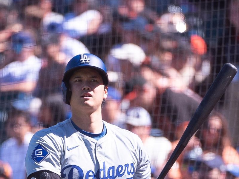 Jun 29, 2024; San Francisco, California, USA; Los Angeles Dodgers two-way player Shohei Ohtani (17) looks on before his at bat against the San Francisco Giants at Oracle Park. Mandatory Credit: Ed Szczepanski-USA TODAY Sports