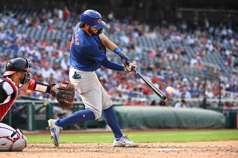 Sep 1, 2024; Washington, District of Columbia, USA; Chicago Cubs shortstop Dansby Swanson (7) hits the ball into play against the Washington Nationals during the ninth inning at Nationals Park. Mandatory Credit: Rafael Suanes-USA TODAY Sports