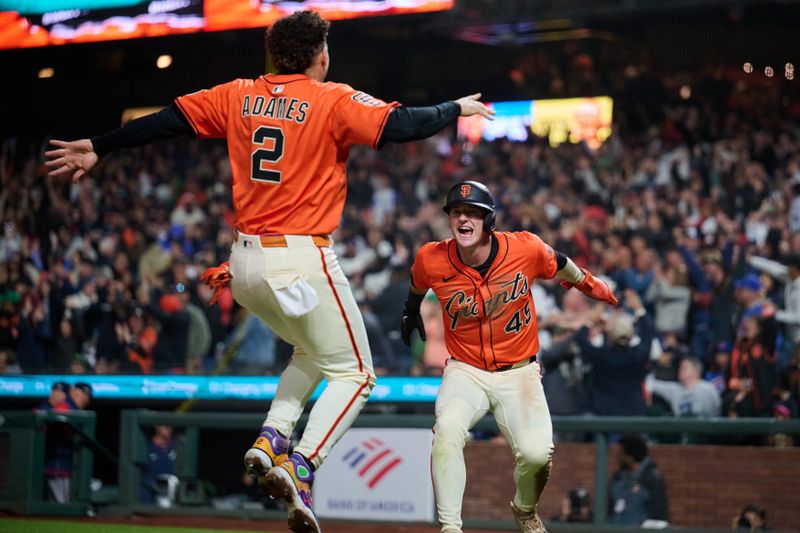 Jun 6, 2025; San Francisco, California, USA; San Francisco Giants shortstop Willy Adames (2) leaps to celebrate the walk-off winning run scored by second baseman Tyler Fitzgerald (49) against the Atlanta Braves during the tenth inning at Oracle Park. Mandatory Credit: Robert Edwards-Imagn Images