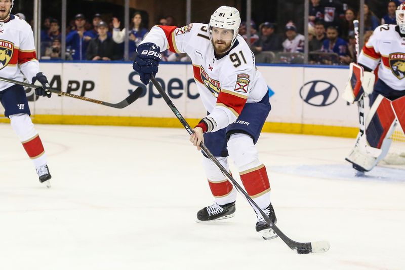 Mar 4, 2024; New York, New York, USA;  Florida Panthers defenseman Oliver Ekman-Larsson (91) controls the puck in the third period against the New York Rangers at Madison Square Garden. Mandatory Credit: Wendell Cruz-USA TODAY Sports