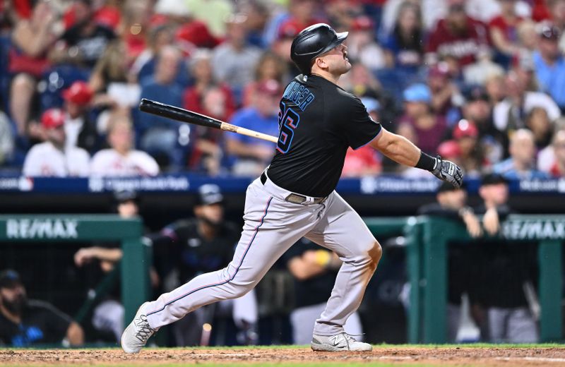 Sep 9, 2023; Philadelphia, Pennsylvania, USA; Miami Marlins third baseman Jake Burger (36) hits a sacrifice fly against the Philadelphia Phillies in the fifth inning at Citizens Bank Park. Mandatory Credit: Kyle Ross-USA TODAY Sports