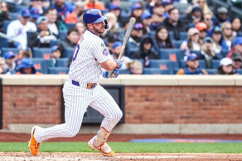 Apr 13, 2024; New York City, New York, USA;  New York Mets first baseman Pete Alonso (20) hits an RBI single in the first inning against the Kansas City Royals at Citi Field. Mandatory Credit: Wendell Cruz-USA TODAY Sports
