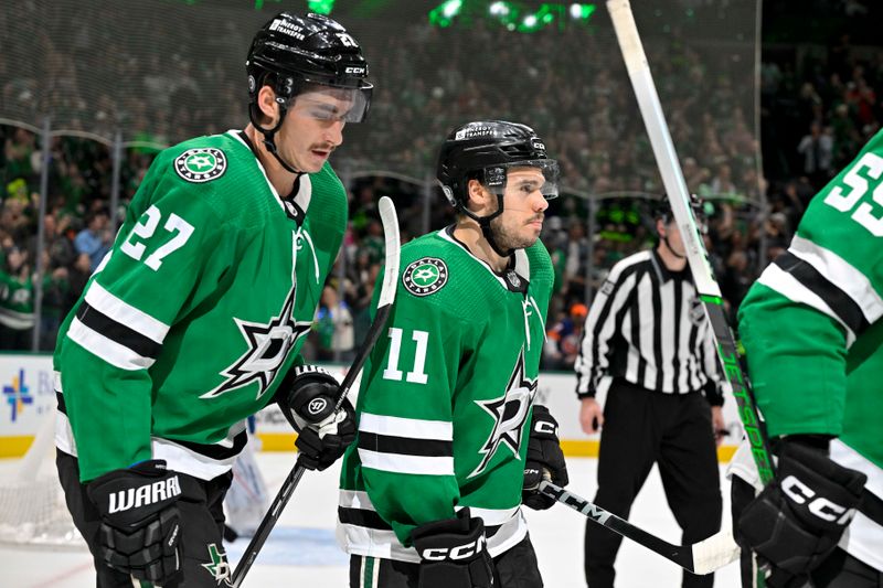 Feb 26, 2024; Dallas, Texas, USA; Dallas Stars left wing Mason Marchment (27) and center Logan Stankoven (11) skate off the ice after center Matt Duchene (not pictured) scores a goal against the New York Islanders during the second period at the American Airlines Center. Stankoven scores his first career NHL point. Mandatory Credit: Jerome Miron-USA TODAY Sports