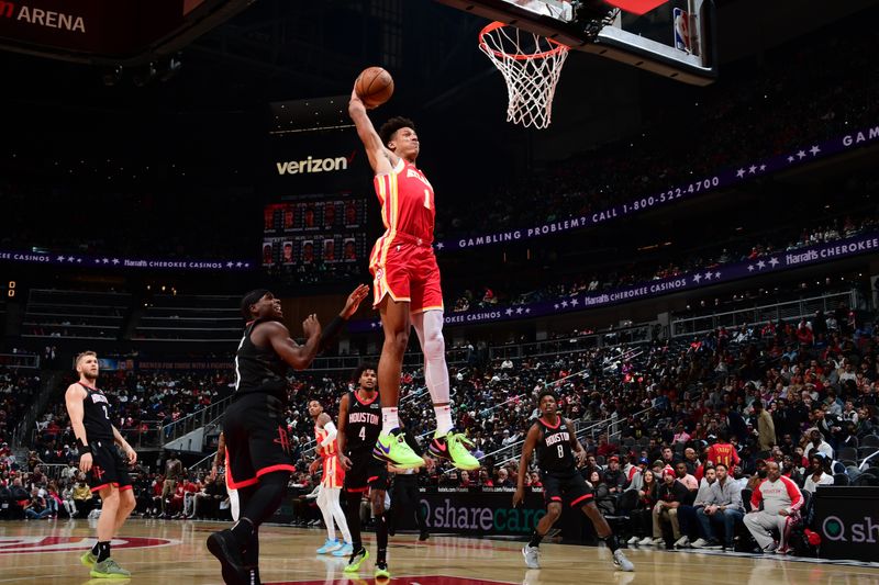 ATLANTA, GA - FEBRUARY 10: Jalen Johnson #1 of the Atlanta Hawks drives to the basket during the game against the Houston Rockets on February 10, 2024 at State Farm Arena in Atlanta, Georgia.  NOTE TO USER: User expressly acknowledges and agrees that, by downloading and/or using this Photograph, user is consenting to the terms and conditions of the Getty Images License Agreement. Mandatory Copyright Notice: Copyright 2024 NBAE (Photo by Scott Cunningham/NBAE via Getty Images)