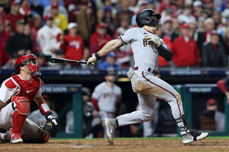 Oct 24, 2023; Philadelphia, Pennsylvania, USA; Arizona Diamondbacks left fielder Corbin Carroll (7) hits a RBI sacrifice fly ball against the Philadelphia Phillies in the seventh inning for game seven of the NLCS for the 2023 MLB playoffs at Citizens Bank Park. Mandatory Credit: Bill Streicher-USA TODAY Sports