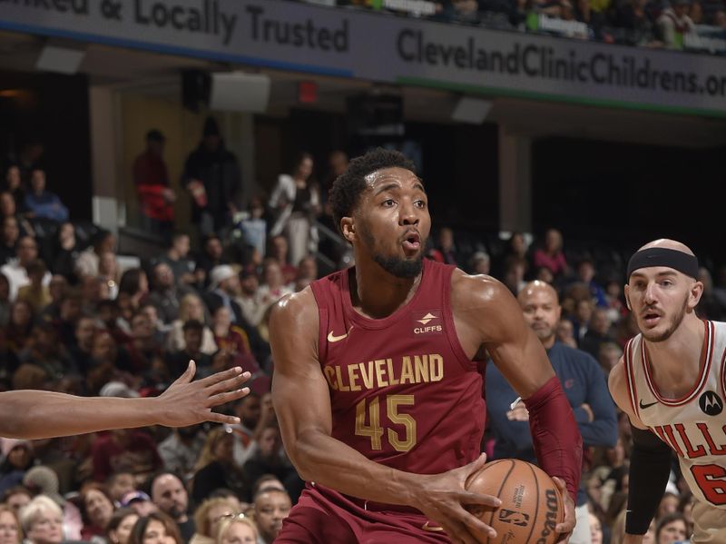 CLEVELAND, OH - FEBRUARY 14: Donovan Mitchell #45 of the Cleveland Cavaliers drives to the basket during the game against the Chicago Bulls on February 14, 2024 at Rocket Mortgage FieldHouse in Cleveland, Ohio. NOTE TO USER: User expressly acknowledges and agrees that, by downloading and/or using this Photograph, user is consenting to the terms and conditions of the Getty Images License Agreement. Mandatory Copyright Notice: Copyright 2024 NBAE (Photo by David Liam Kyle/NBAE via Getty Images)