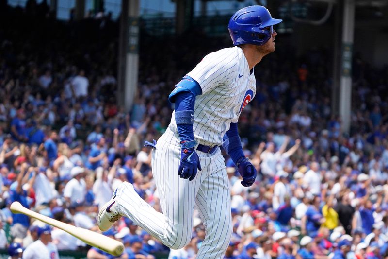 Jul 23, 2023; Chicago, Illinois, USA; Chicago Cubs center fielder Cody Bellinger (24) hits a two-run homer against the St. Louis Cardinals during the first inning at Wrigley Field. Mandatory Credit: David Banks-USA TODAY Sports