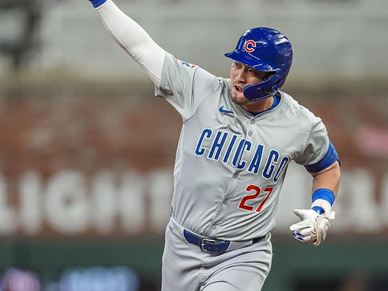 May 15, 2024; Cumberland, Georgia, USA; Chicago Cubs right fielder Seiya Suzuki (27) reacts after hitting a home run against the Atlanta Braves during the eighth inning at Truist Park. Mandatory Credit: Dale Zanine-USA TODAY Sports