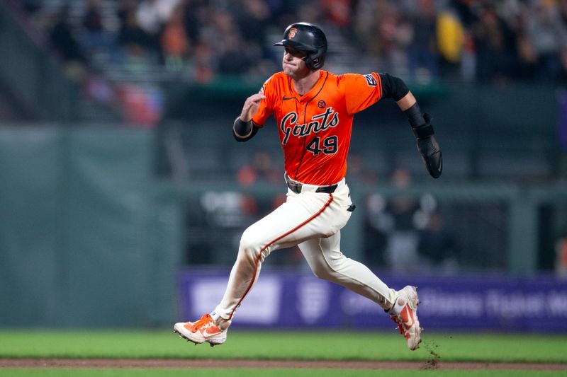 Aug 9, 2024; San Francisco, California, USA; San Francisco Giants shortstop Tyler Fitzgerald (49) goes from first to third on a single by Heliot Ramos during the seventh inning against the Detroit Tigers at Oracle Park. Mandatory Credit: D. Ross Cameron-USA TODAY Sports