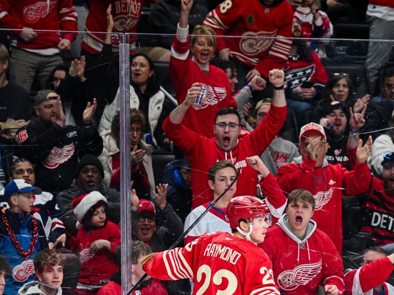 Dec 21, 2025; Detroit, Michigan, USA; Detroit Red Wings left wing Lucas Raymond (23) celebrates his goal during the second period against the Washington Capitals at Little Caesars Arena. Mandatory Credit: Tim Fuller-Imagn Images