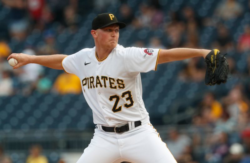 Jul 18, 2023; Pittsburgh, Pennsylvania, USA;  Pittsburgh Pirates starting pitcher Mitch Keller (23) delivers a pitch against the Cleveland Guardians during the first inning at PNC Park. Mandatory Credit: Charles LeClaire-USA TODAY Sports