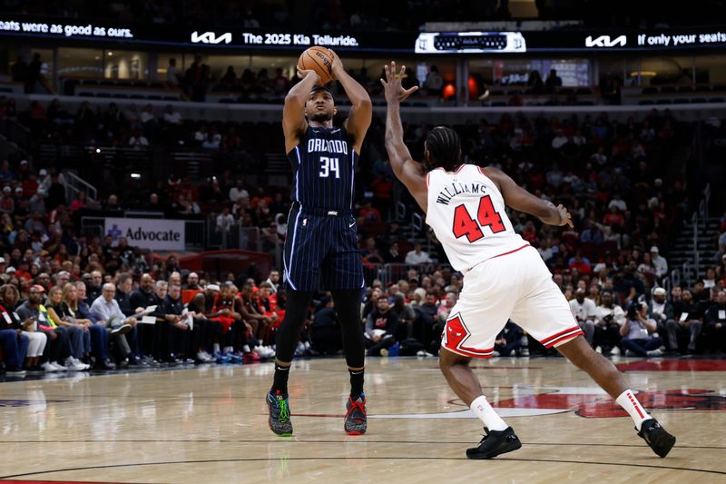 CHICAGO, IL - OCTOBER 30: Wendell Carter Jr. #34 of the Orlando Magic shoots a three point basket during the game against the Chicago Bulls on October 30, 2024 at United Center in Chicago, Illinois. NOTE TO USER: User expressly acknowledges and agrees that, by downloading and or using this photograph, User is consenting to the terms and conditions of the Getty Images License Agreement. Mandatory Copyright Notice: Copyright 2024 NBAE (Photo by Kamil Krzaczynski/NBAE via Getty Images)