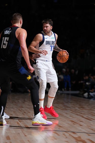 DENVER, CO - DECEMBER 18: Luka Doncic #77 of the Dallas Mavericks dribbles the ball during the game against the Denver Nuggets on December 18, 2023 at the Ball Arena in Denver, Colorado. NOTE TO USER: User expressly acknowledges and agrees that, by downloading and/or using this Photograph, user is consenting to the terms and conditions of the Getty Images License Agreement. Mandatory Copyright Notice: Copyright 2023 NBAE (Photo by Garrett Ellwood/NBAE via Getty Images)