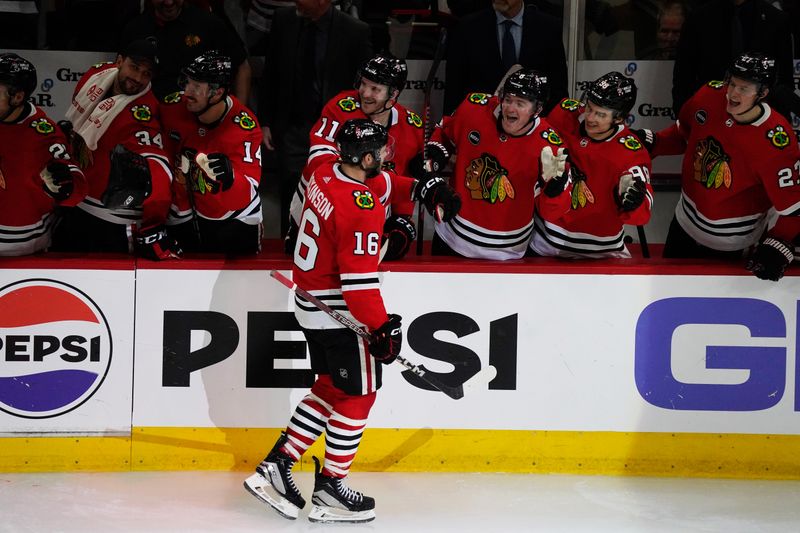 Nov 24, 2023; Chicago, Illinois, USA; Chicago Blackhawks center Jason Dickinson (16) celebrates his hat trick against the Toronto Maple Leafs during the third period at United Center. Mandatory Credit: David Banks-USA TODAY Sports