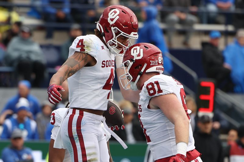 Nov 18, 2023; Provo, Utah, USA; Oklahoma Sooners wide receiver Nic Anderson (4) celebrates a first down with Oklahoma Sooners tight end Austin Stogner (81) against the Brigham Young Cougars in the first quarter at LaVell Edwards Stadium. Mandatory Credit: Rob Gray-USA TODAY Sports