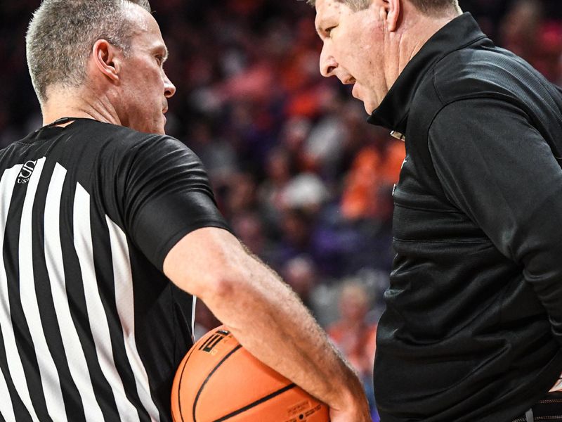 Feb 27, 2024; Clemson, South Carolina, USA; Clemson Head Coach Brad Brownell talks with a referee during the second half at Littlejohn Coliseum. Mandatory Credit: Ken Ruinard-USA TODAY Sports