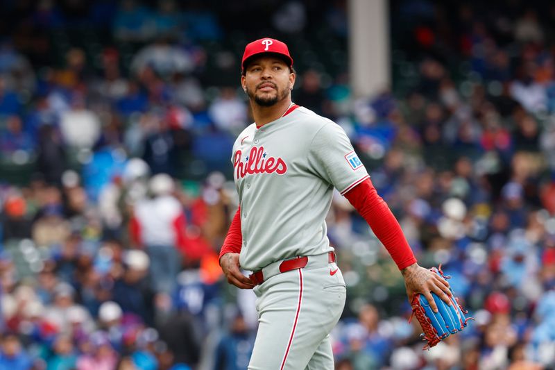 Apr 25, 2025; Chicago, Illinois, USA; Philadelphia Phillies starting pitcher Taijuan Walker (99) walks back to the dugout after the second inning of a baseball game against the Chicago Cubs at Wrigley Field. Mandatory Credit: Kamil Krzaczynski-Imagn Images