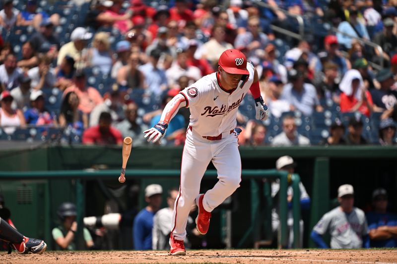 Jul 4, 2024; Washington, District of Columbia, USA; Washington Nationals center fielder Jacob Young (30) drops his bat on his way to first base against the New York Mets during the sixth inning at Nationals Park. Mandatory Credit: Rafael Suanes-USA TODAY Sports