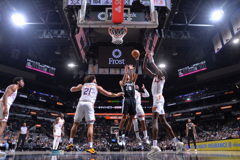 SAN ANTONIO, TX - MARCH 23: Dominick Barlow #26 of the San Antonio Spurs drives to the basket during the game against the Phoenix Suns on March 23, 2024 at the Frost Bank Center in San Antonio, Texas. NOTE TO USER: User expressly acknowledges and agrees that, by downloading and or using this photograph, user is consenting to the terms and conditions of the Getty Images License Agreement. Mandatory Copyright Notice: Copyright 2024 NBAE (Photos by Michael Gonzales/NBAE via Getty Images)