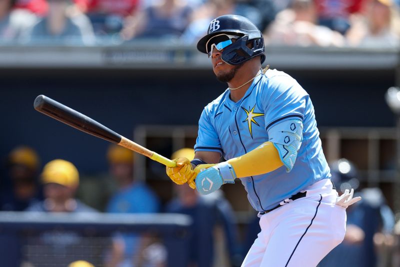 Mar 7, 2024; Port Charlotte, Florida, USA;  Tampa Bay Rays designated hitter Isaac Paredes (17) hits a double against the Philadelphia Phillies in the first inning at Charlotte Sports Park. Mandatory Credit: Nathan Ray Seebeck-USA TODAY Sports