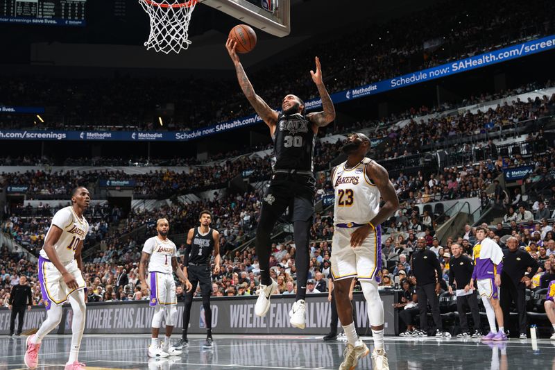 SAN ANTONIO, TX - NOVEMBER 15: Julian Champagnie #30 of the San Antonio Spurs drives to the basket during the game against the Los Angeles Lakers during the Emirates NBA Cup game on November 15, 2024 at the Frost Bank Center in San Antonio, Texas. NOTE TO USER: User expressly acknowledges and agrees that, by downloading and or using this photograph, user is consenting to the terms and conditions of the Getty Images License Agreement. Mandatory Copyright Notice: Copyright 2024 NBAE (Photos by Jesse D. Garrabrant/NBAE via Getty Images)