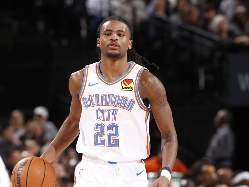 PORTLAND, OR - MARCH 6: Cason Wallace #22 of the Oklahoma City Thunder  handles the ball during the game against the Portland Trail Blazers on March 6, 2024 at the Moda Center Arena in Portland, Oregon. NOTE TO USER: User expressly acknowledges and agrees that, by downloading and or using this photograph, user is consenting to the terms and conditions of the Getty Images License Agreement. Mandatory Copyright Notice: Copyright 2024 NBAE (Photo by Cameron Browne/NBAE via Getty Images)