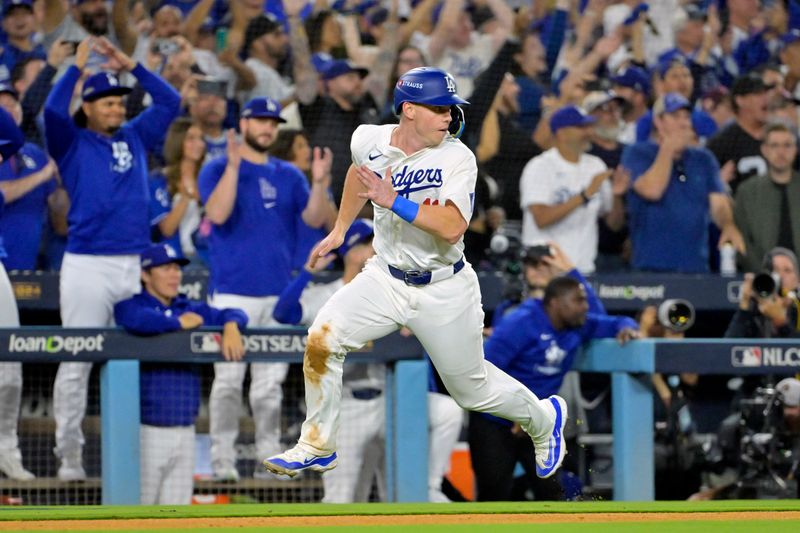 Oct 20, 2024; Los Angeles, California, USA; Los Angeles Dodgers catcher Will Smith (16) runs home to score on a single by designated hitter Shohei Ohtani (not pictured) in the sixth inning against the New York Mets during game six of the NLCS for the 2024 MLB playoffs at Dodger Stadium. Mandatory Credit: Jayne Kamin-Oncea-Imagn Images