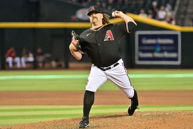 Apr 26, 2023; Phoenix, Arizona, USA; Arizona Diamondbacks relief pitcher Andrew Chafin (57) throws in the ninth inning against the Kansas City Royals at Chase Field. Mandatory Credit: Matt Kartozian-USA TODAY Sports