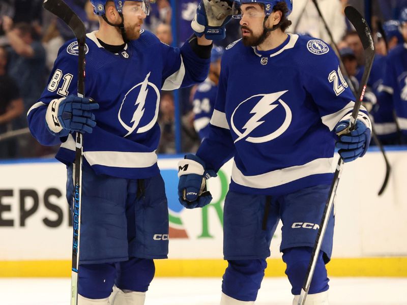 Apr 15, 2024; Tampa, Florida, USA; Tampa Bay Lightning defenseman Erik Cernak (81) is congratulated by left wing Nicholas Paul (20) after he scored a goal against the Buffalo Sabres  during the third period at Amalie Arena. Mandatory Credit: Kim Klement Neitzel-USA TODAY Sports